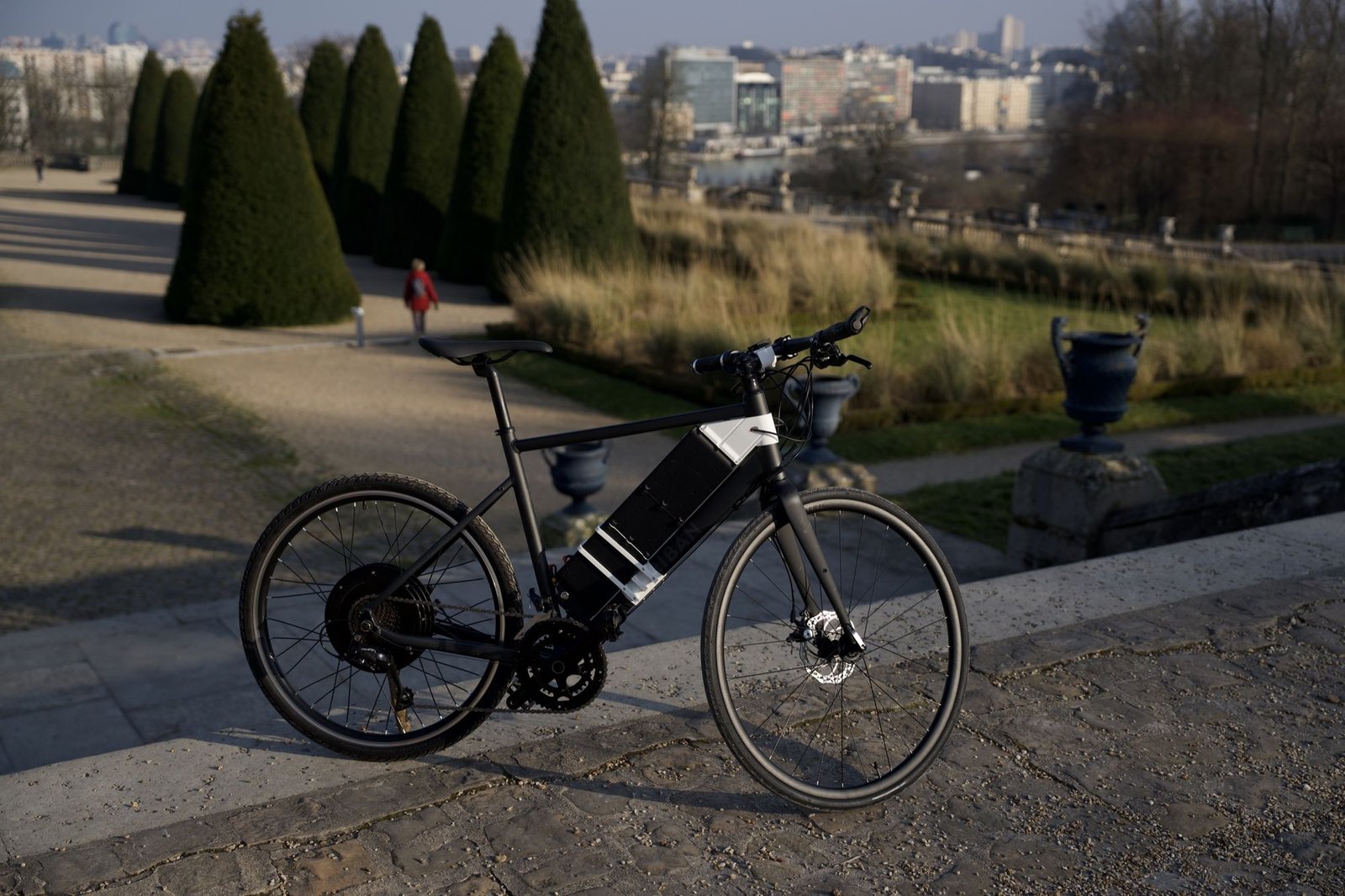 The Styx bike among the clipped yews of a park
